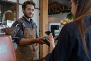 customer paying using her phone jpeg