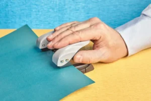 hand makes holes paper office punch hole mock up pushes copy space 124883848