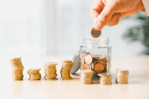 hand places coin saving jar representing how smart finance investment banking practices turn money cash currency hand 402761954