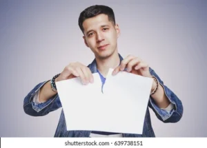 man tearing paper 260nw 639738151