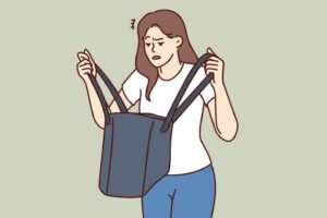 woman is nervous looking into purse and seeks lost keys or purse forgotten at home confused girl stands with bag in hands and is disappointed after learning about theft of wallet with money vector
