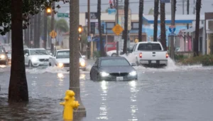 Flooded. streat cars driwing in water