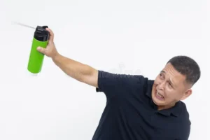 anxious scared middle aged asian man dark shirt using insect spray concept entomophobia katsaridaphobia pest 307895967