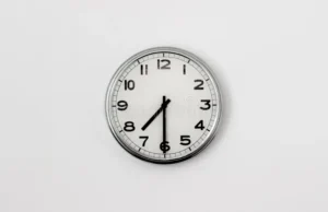 clock round face displaying half past 102068818
