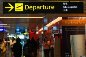 departure sign singapore changi airport hangs over busy travellers terminal hall opened major 54692454