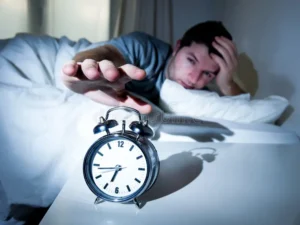 sleeping man disturbed alarm clock early mornin tired morning feeling lazy 36862122