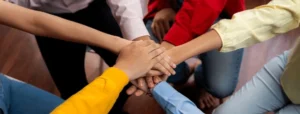 startup company employee team stacking 600nw 2481002203