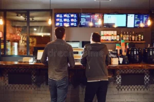 two men choose food fast restaurant rear view bar snack concept 140803072